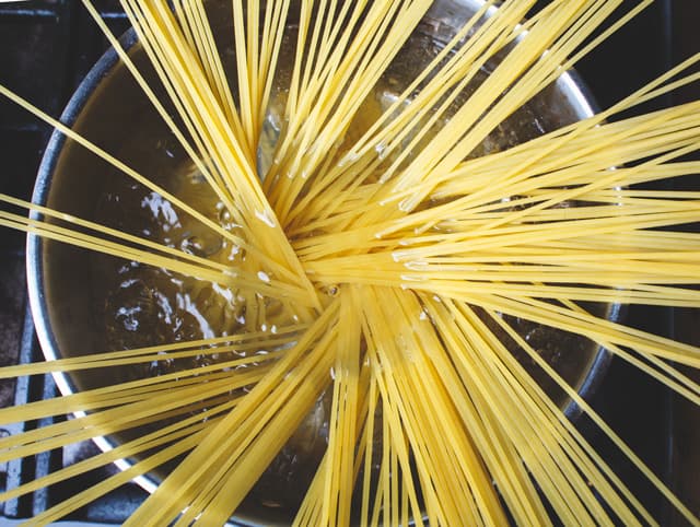 Uncooked Spaghetti Pasta In Boiling Water